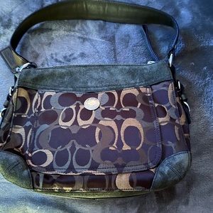 11in by 8 in green suede and gold Coach bag. Never used in perfect condition